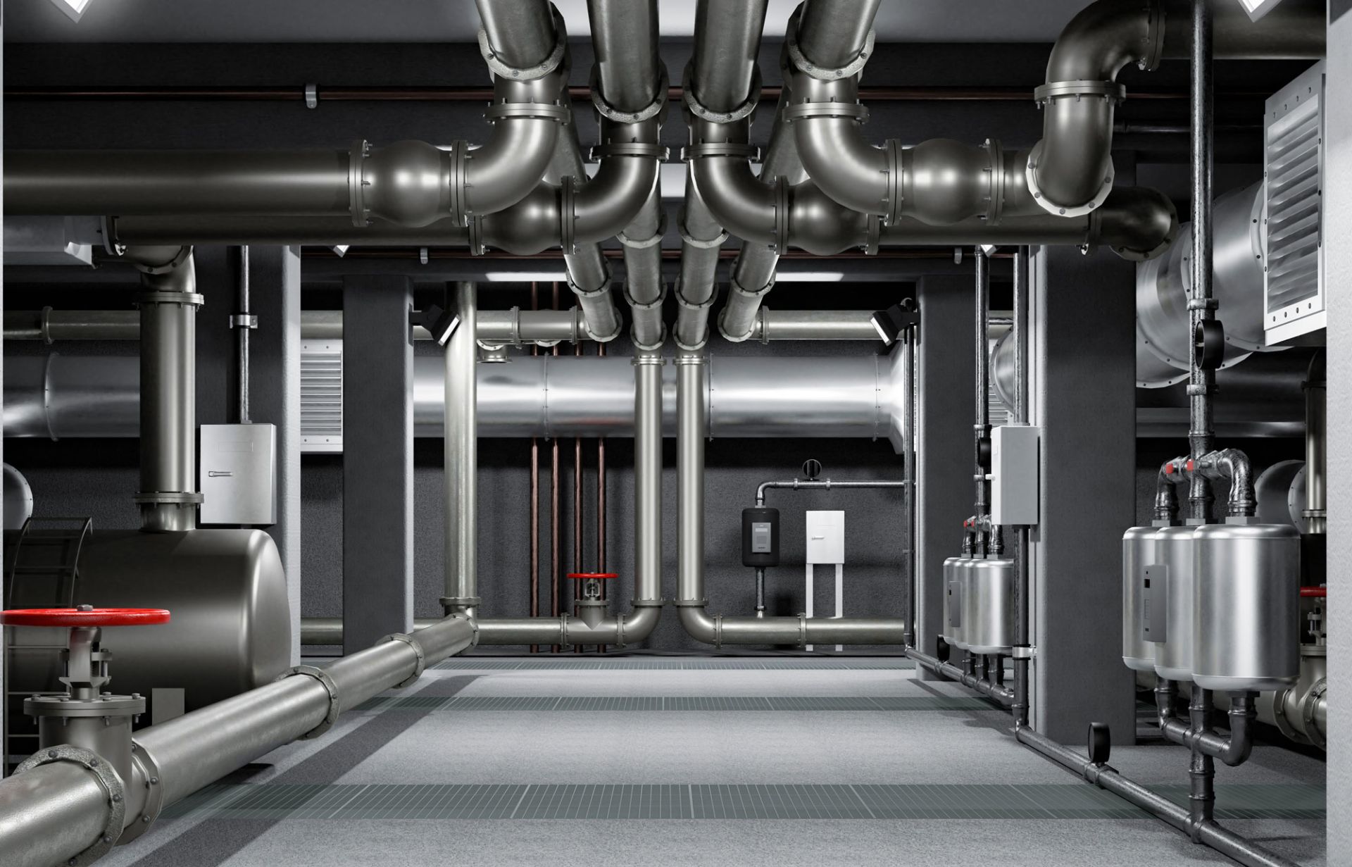 Zu sehen ist ein Technikraum mit zahlreichen Edelstahlrohren und Heizungsanlagen in industrieller Umgebung.
